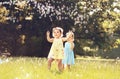 Little girl blowing soap bubbles on a summer meadow Royalty Free Stock Photo