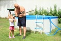 Little girl with blowpipe Royalty Free Stock Photo