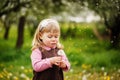 The little girl blows a dandelion Royalty Free Stock Photo