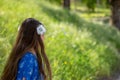 Little Girl in Blue Dress Smiling in Front of Field with Flowers Royalty Free Stock Photo