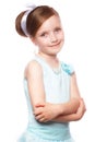 A little girl in a blue dress, with a retro hairstyle and accessories. Royalty Free Stock Photo