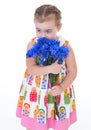 Little girl with blue flowers Royalty Free Stock Photo