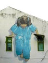 `Little girl in blue` painting on building walls, landmark of George town, Penang, Malaysia