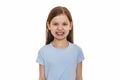 Little girl in a blue T-shirt on a white background.