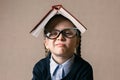 Little girl with a book over her head