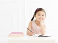 Little girl with book studying