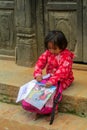 Little girl with books and small school backpack