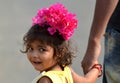 Little girl with bougainvillea flower Royalty Free Stock Photo