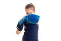Little girl in boxing gloves practicing by punch Royalty Free Stock Photo