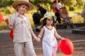 Little girl and boy with balloons in the park Royalty Free Stock Photo