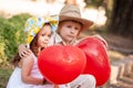 Little girl and boy with balloons in the park Royalty Free Stock Photo