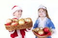 Little girl and boy in christmas clothes with toys