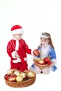 Little girl and boy in christmas clothes with toys