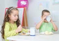Little girl and boy eating Royalty Free Stock Photo
