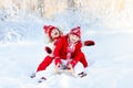 Kids play in snow. Winter sleigh ride for children Royalty Free Stock Photo