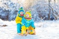 Kids play in snow. Winter sled ride for children Royalty Free Stock Photo