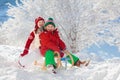 Kids play in snow. Winter sled ride for children Royalty Free Stock Photo