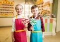 Little girl and boy holds in hands fresh lollipop Royalty Free Stock Photo