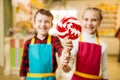 Little girl and boy holds in hands fresh lollipop Royalty Free Stock Photo