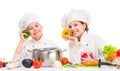 Little girl and boy with pan and ingredients for soup Royalty Free Stock Photo