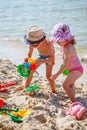 Little girl and boy playing on the beach Royalty Free Stock Photo