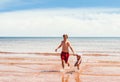 Little girl and boy playing on the beach Royalty Free Stock Photo