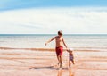 Little girl and boy playing on the beach Royalty Free Stock Photo