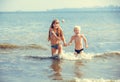 Little girl and boy in the sea Royalty Free Stock Photo