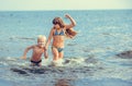 Little girl and boy in the sea Royalty Free Stock Photo