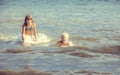 Little girl and boy in the sea Royalty Free Stock Photo