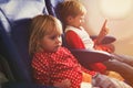 Little girl and boy travel by plane Royalty Free Stock Photo