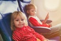 Little girl and boy travel by plane Royalty Free Stock Photo
