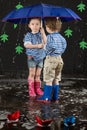 Little girl and boy under a blue umbrella hiding Royalty Free Stock Photo