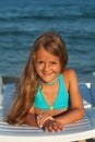 Little girl in bright sunshine at the seaside Royalty Free Stock Photo