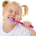 A little girl brushes her teeth. Royalty Free Stock Photo