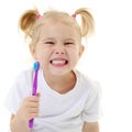 A little girl brushes her teeth. Royalty Free Stock Photo