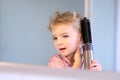 Little girl brushing her hair Royalty Free Stock Photo