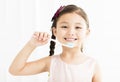 Little girl brushing her teeth