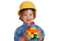 Little girl builder with toy block house Royalty Free Stock Photo