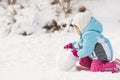 Little girl building a snowman Royalty Free Stock Photo