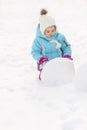 Little girl building a snowman Royalty Free Stock Photo