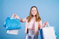 Little girl with bunch packages. Fashion girl customer. Happy child in shop with bags. Shopping day happiness. Buy Royalty Free Stock Photo
