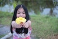 Little girl with bunch of yellow tulips outdoors Royalty Free Stock Photo