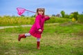 A little girl with butterfly net having fun Royalty Free Stock Photo