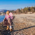 Little girl with butterfly wings running along the Royalty Free Stock Photo