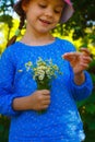 Little girl with camomile flowers Royalty Free Stock Photo