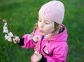 Little girl in cap with dandelion Royalty Free Stock Photo