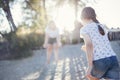 A little girl in casual clothes runs across the sand to her mother. The young woman opened her arms and is waiting for her child Royalty Free Stock Photo