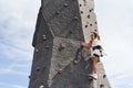 Little girl in casual white clothes training rock climbing outdoors Royalty Free Stock Photo