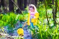 Little girl catching a frog